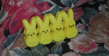 Four rabbit candies on a fabric surface